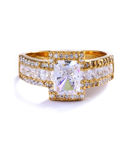 Engagement Ring - 1.75 Cts. Radiant Emerald cut Diamond Essence set in center surrounded by Round Melee and Princess cut Diamond Essence, which flows on band also, making three shinning rows on either side. 5.0 Cts. T. W.