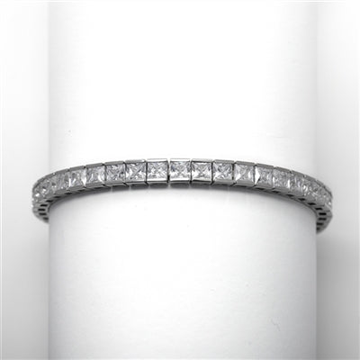 14K Solid Yellow Gold tennis bracelet strung with 43 princess cut masterpieces in a mesmerizing array, with double safety clasp, 12.0 cts. T.W.