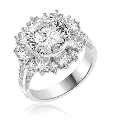 Classic Designer Ring with 3.0 Cts. Round Brilliant Diamond Essence Stone in the center, surrounded by 0.5 Ct. each Princess cut stones and round stones. Round melee set on band, makes it more artistic. 7.25 Cts.T. W. set in 14K Solid White Gold.