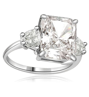 Diamond Essence emerald-cut brilliant stone of 5.0 cts. setting with trilliant baguette on each side. 6.0 cts.T.W. set in 14K Solid White Gold.