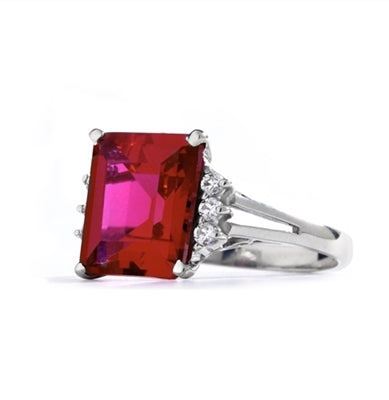 Superb Ring with 5 Cts Emerald Cut Ruby Essence Center Stone and melee accents for a total of 5.2 Cts.t.w. in 14K Solid White Gold.