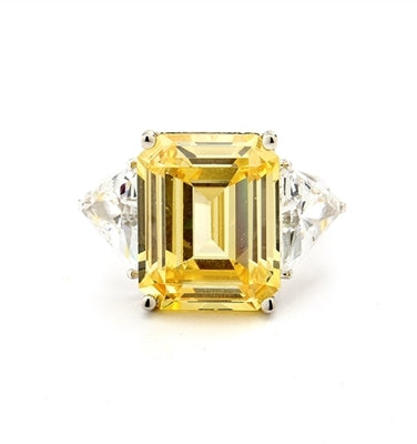 Designer Ring with 13.0 cts. Canary Essence Emerald in center and triangle stones on each side. 21.0 Cts. T.W. set in 14K Solid White Gold.
