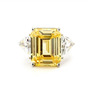 Designer Ring with 13.0 cts. Canary Essence Emerald in center and triangle stones on each side. 21.0 Cts. T.W. set in 14K Solid White Gold.