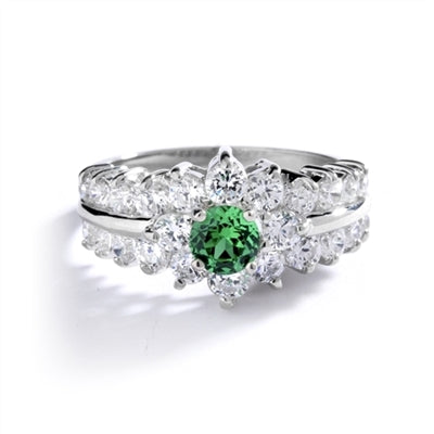 Greenpeace - 1.25 Carats Emerald Center is surrounded by supremely crafted masterpieces. In 14k Solid White Gold.