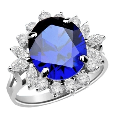 Amazingly beautiful Ring with White Brilliant Marquise and Round accents surrounding a 5 Ct. Blue Star Sapphire Cabochan Center, which in light will revel a Star! . 14K Solid White Gold.
