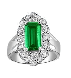Emerald City Ring with a 3 Ct Emerald Cut Emerald Essence center surrounded by fiery Round Cut Diamond Essence Stones, 3.3 Cts.t.w. in 14K Solid White Gold.