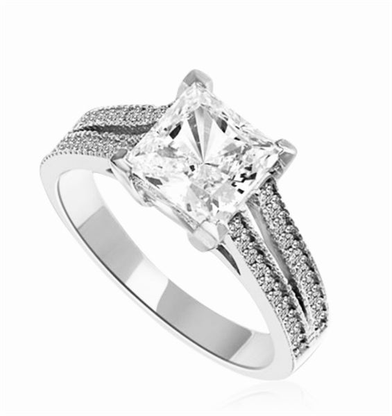 Diamond Essence Ring with Princess in Center accompanied by two rows of melee on each side. 3.25 Cts T.W. set in 14K solid White Gold.