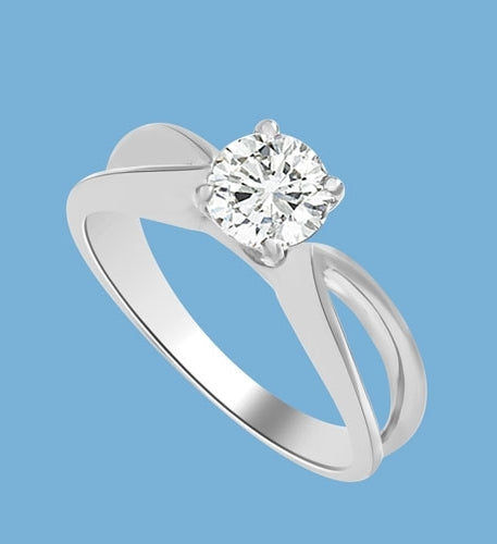 This Ring Is a sureshot hit with jewelry conossieurs. 0.75 Ct. Round Brilliant Masterpiece is set exquisitely on a cross curve band. In 14k Solid White Gold.