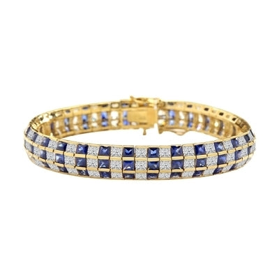 7" long Lovely best selling bracelet with 23.25 Cts. T.W. of square Sapphire Essence and white princess cut stones set in 14K Solid Yellow Gold.