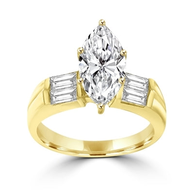 A dazzling one-carat marquise-cut Diamond Essence gem with bold baguettes. 1.5 cts. t.w., in 14K Solid Gold.
