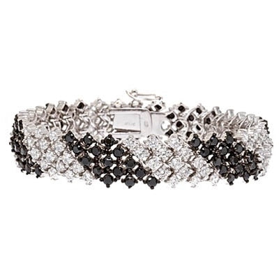 Classic party wear. Diamond essence brilliant round and onyx round cut stones, 010. ct. each set diagonally, in alternate group of three rows. 17.4 cts.t.w.