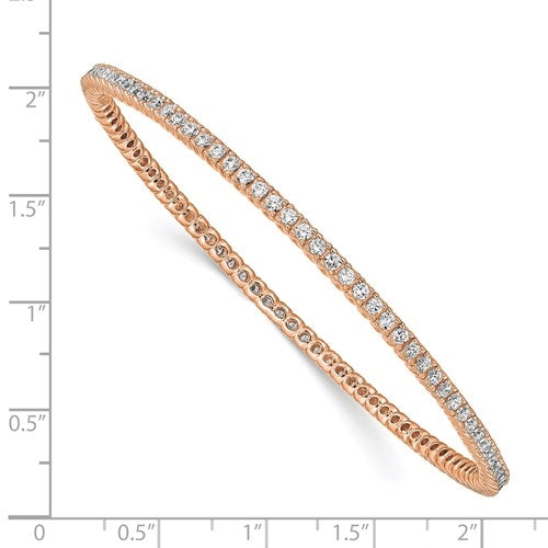 An alluring prong-set slip-on bangle bracelet for women with simulated round brilliant Diamonds by Diamond Essence set in rose  plated sterling silver. 4.65 Cts.t.w.