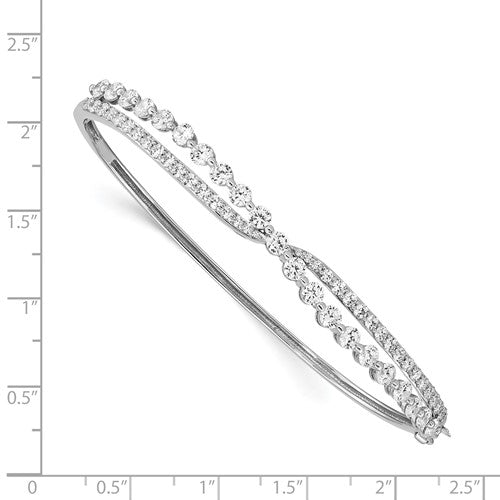 Beautiful designer hinged bracelet for ladies, in the criss-cross setting of round brilliant Diamond Essence stones, 2.75 cts.t.w. in platinum plated sterling silver. It will be highly noticed on your wrist for its beautiful shine and craftmanship.