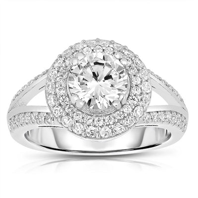 Diamond Essence Designer Ring with 1.25 carat Round Essence in center, surrounded by Round Essence melee in two rows around and two delicate rows on the band for more elegance. Appx. 2.50 Cts. T.W. set in Platinum Plated Sterling Silver.