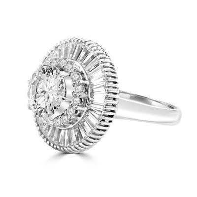 Ring  round stone encircled by baguettes