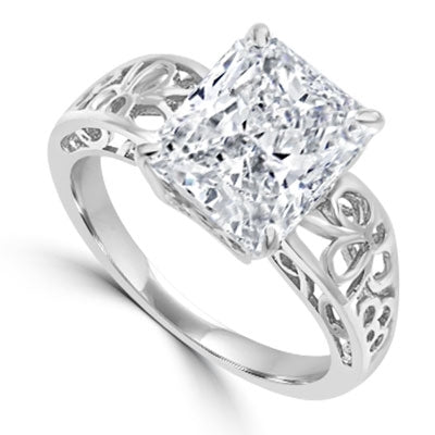 In this finely created ring, a 4 Ct. Radiant Emerald White Brilliant Stone is crafted atop an ethic set wide band. In 14k Gold Vermeil.