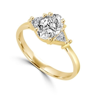 Stunning Ring, 2 Cts. T.W, with 1 Ct Oval Cut Emerald Center  and White Trilliant Diamond Essence Stones on side, in Gold Vermeil.