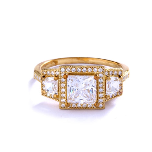 Diamond Essence Ring with 1.5ct. Princess Cut stone set in four prongs with baguettes on each side surrounded by round stones, 2.5ct.T.W. set in 14K Gold Vermeil.