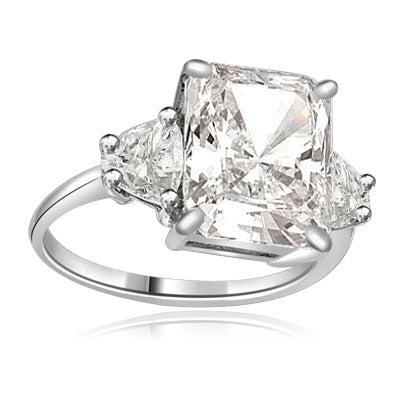 Diamond Essence emerald-cut brilliant stone of 5.0 cts. setting with trilliant baguette on each side. 6.0 cts.T.W. set in 14K Solid White Gold.