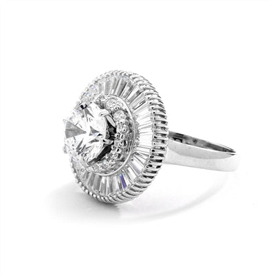 Ring  round stone encircled by baguettes