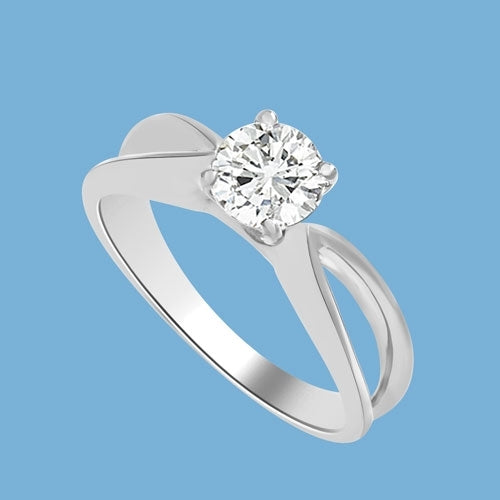This Ring Is a sureshot hit with jewelry conossieurs. 0.75 Ct. Round Brilliant Masterpiece is set exquisitely on a cross curve band. In 14k Solid White Gold.